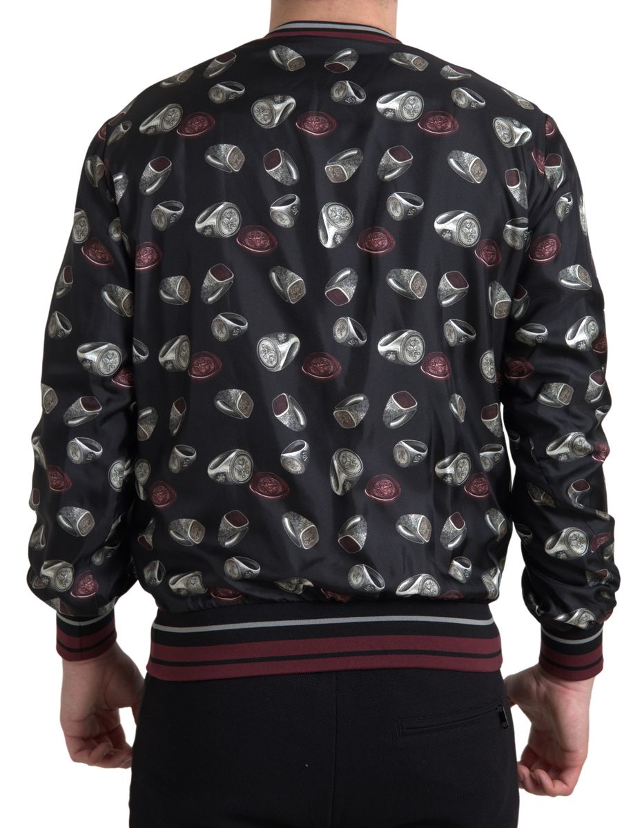 Dolce & Gabbana Schwarzer Ringdruck Seidenpullover mit Rundhalsausschnitt