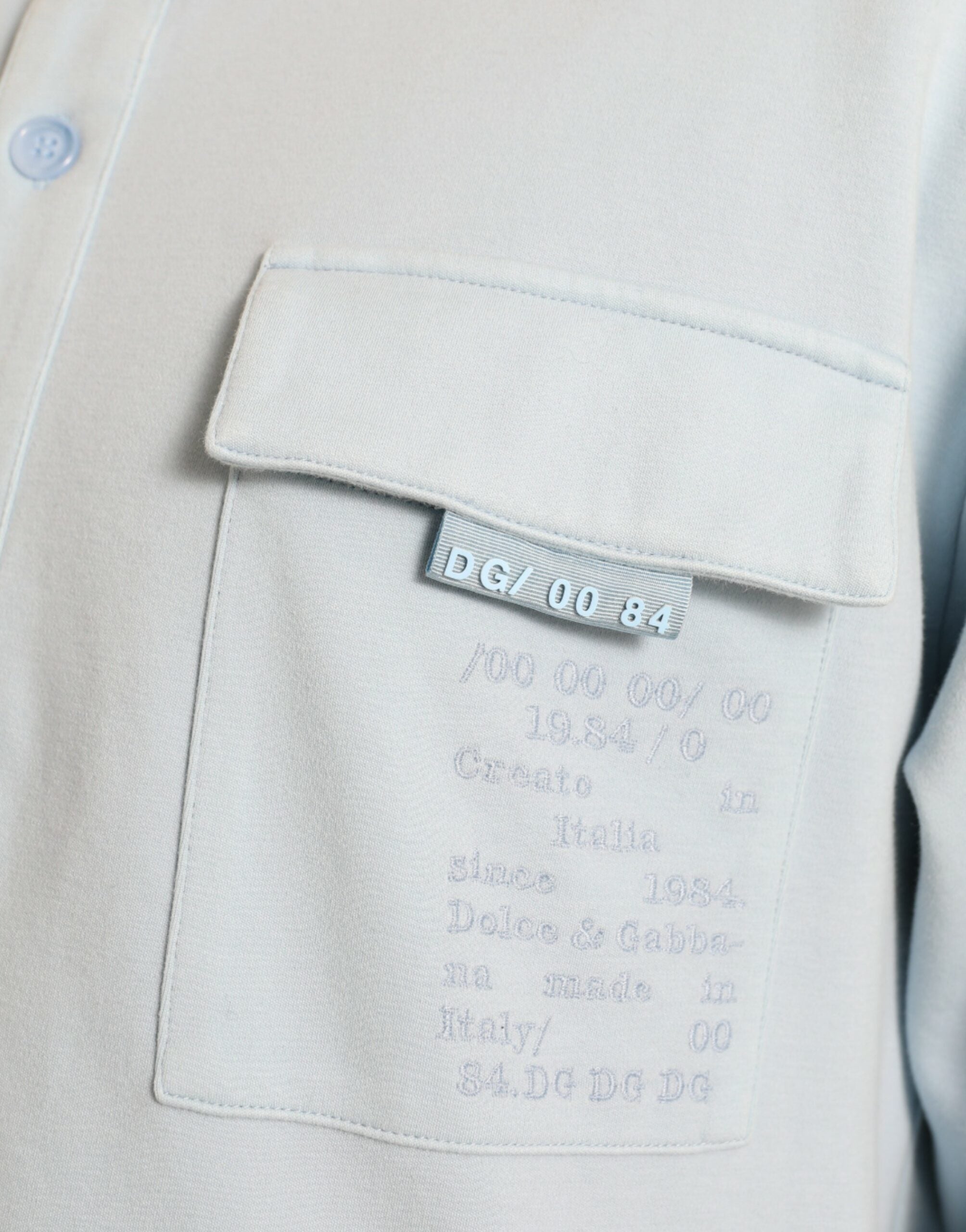 Dolce & Gabbana Hellblauer Pullover aus Baumwolle mit Knöpfen