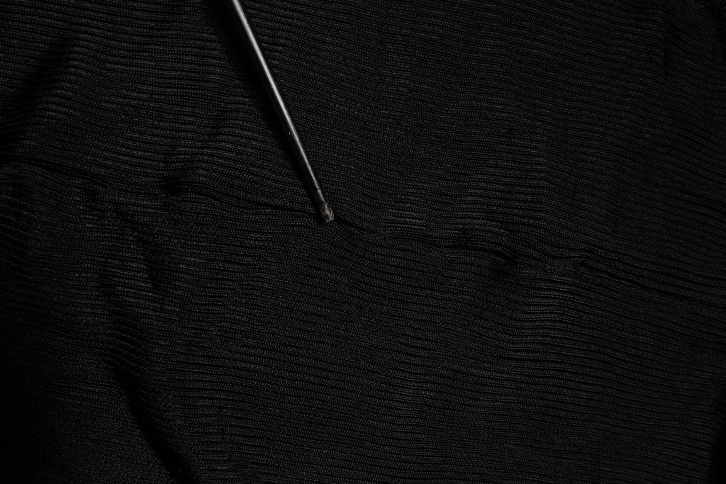 Dolce & Gabbana Schwarzes Strick-Top mit langen Ärmeln und schmalem Rollkragen