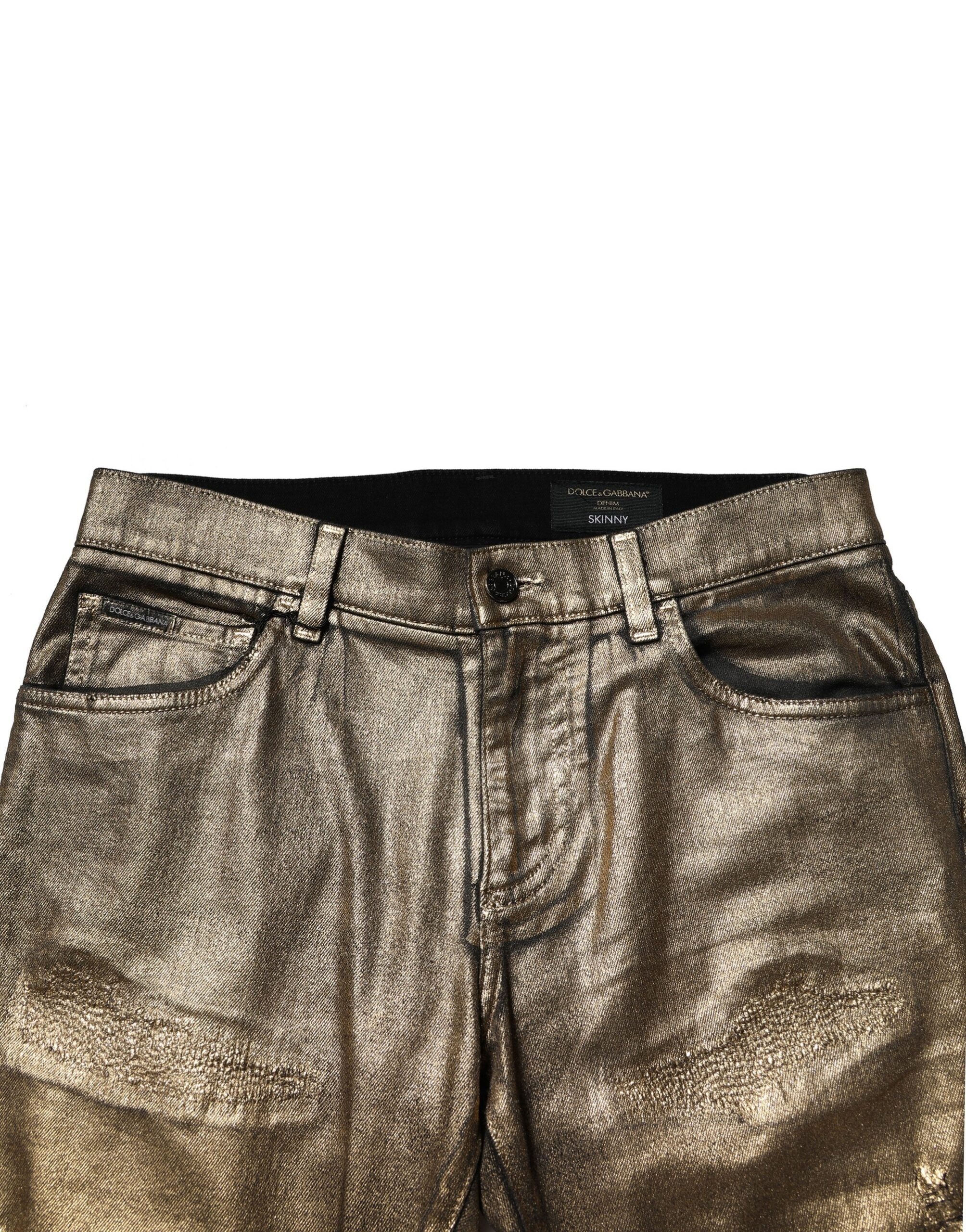 Dolce & Gabbana Goldfarbene zerfetzte Baumwoll-Stretch-Denim-Jeans