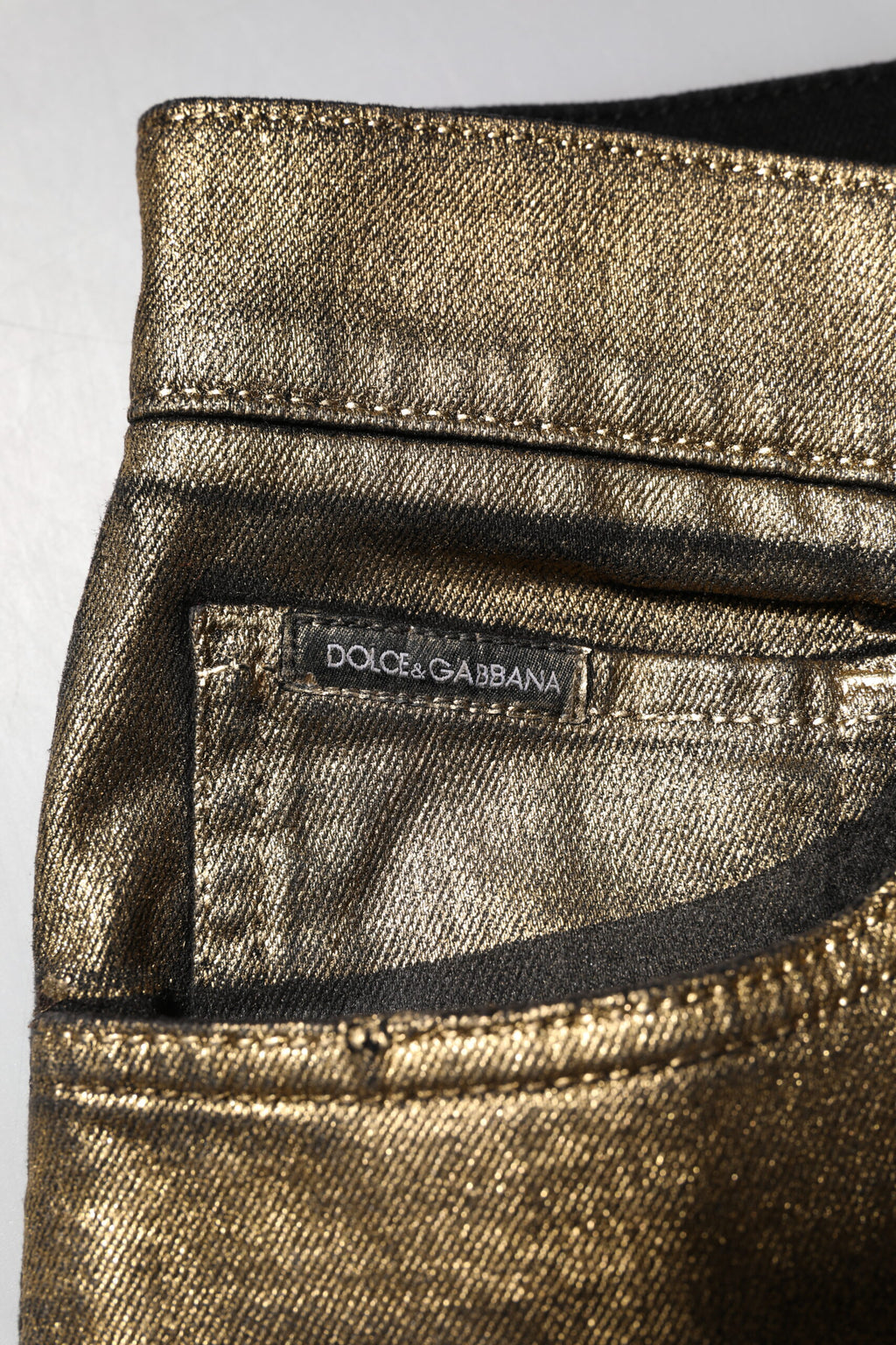Dolce & Gabbana Goldfarbene zerfetzte Baumwoll-Stretch-Denim-Jeans