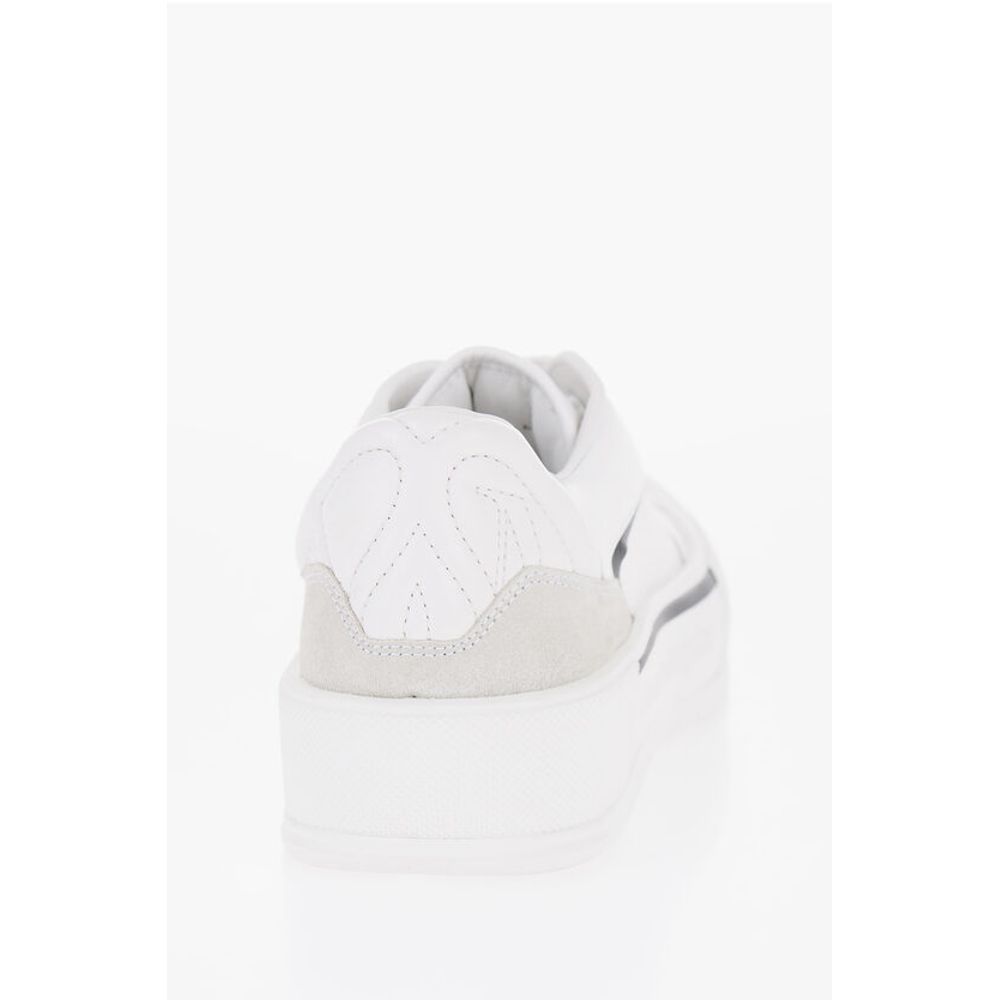 Alexander McQueen Einfarbige Low-Top-Sneakers aus Leder und Segeltuch