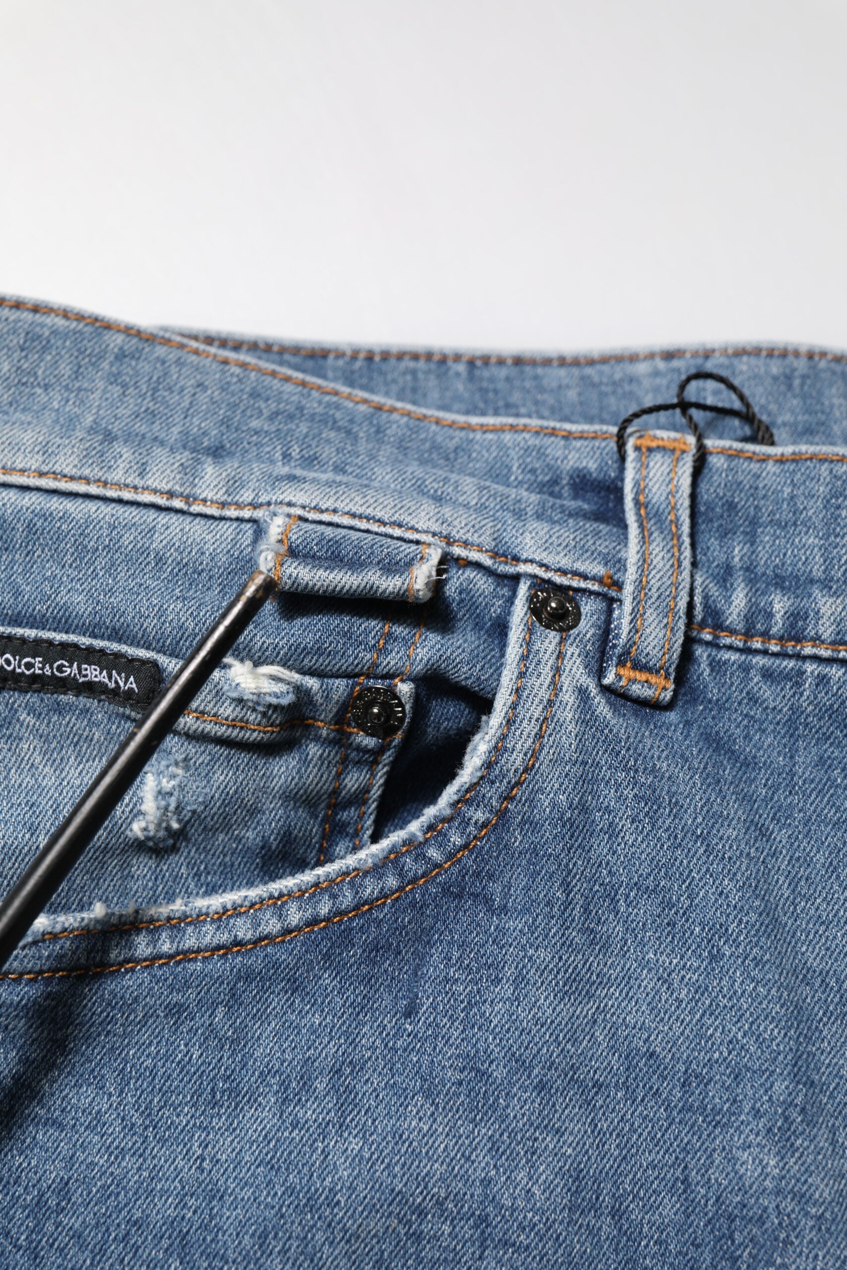 Dolce & Gabbana Blaue zerschlissene Skinny Logo Denim Jeans aus Baumwolle