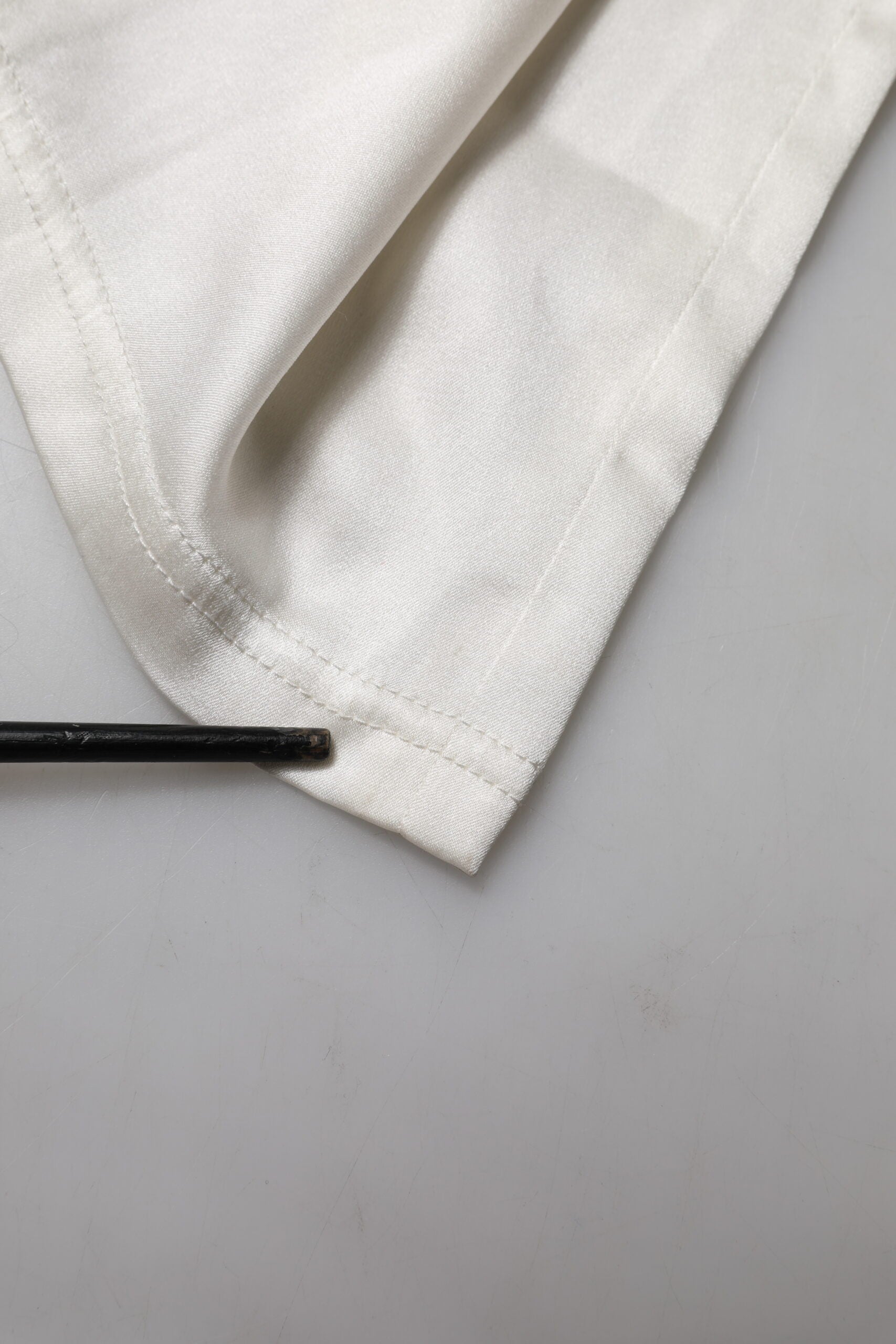 Dolce & Gabbana Elfenbeinfarbene konisch zulaufende Seidenhose mit hoher Taille