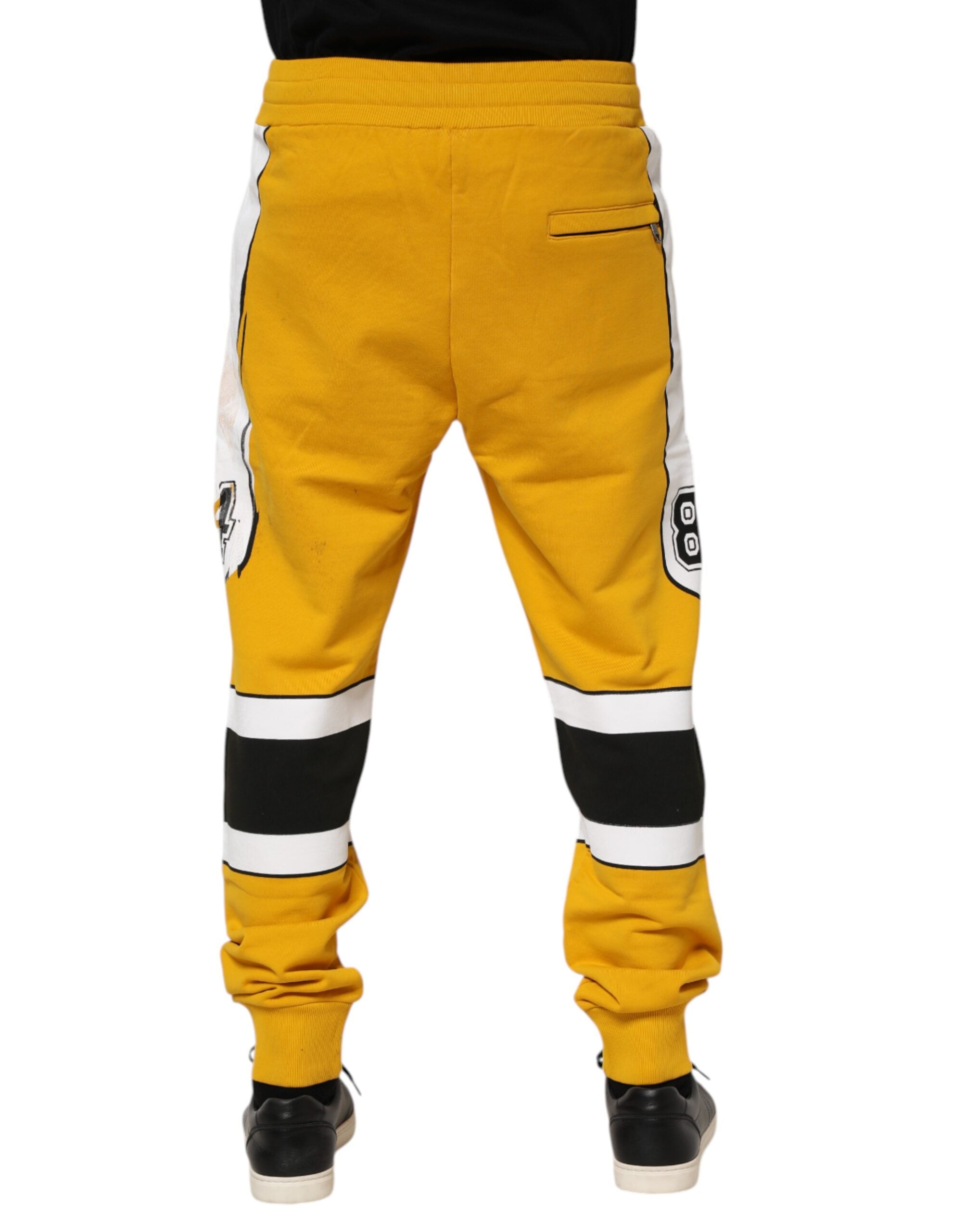 Dolce & Gabbana Gelbe bedruckte Baumwoll-Sweatpants Jogger Pants