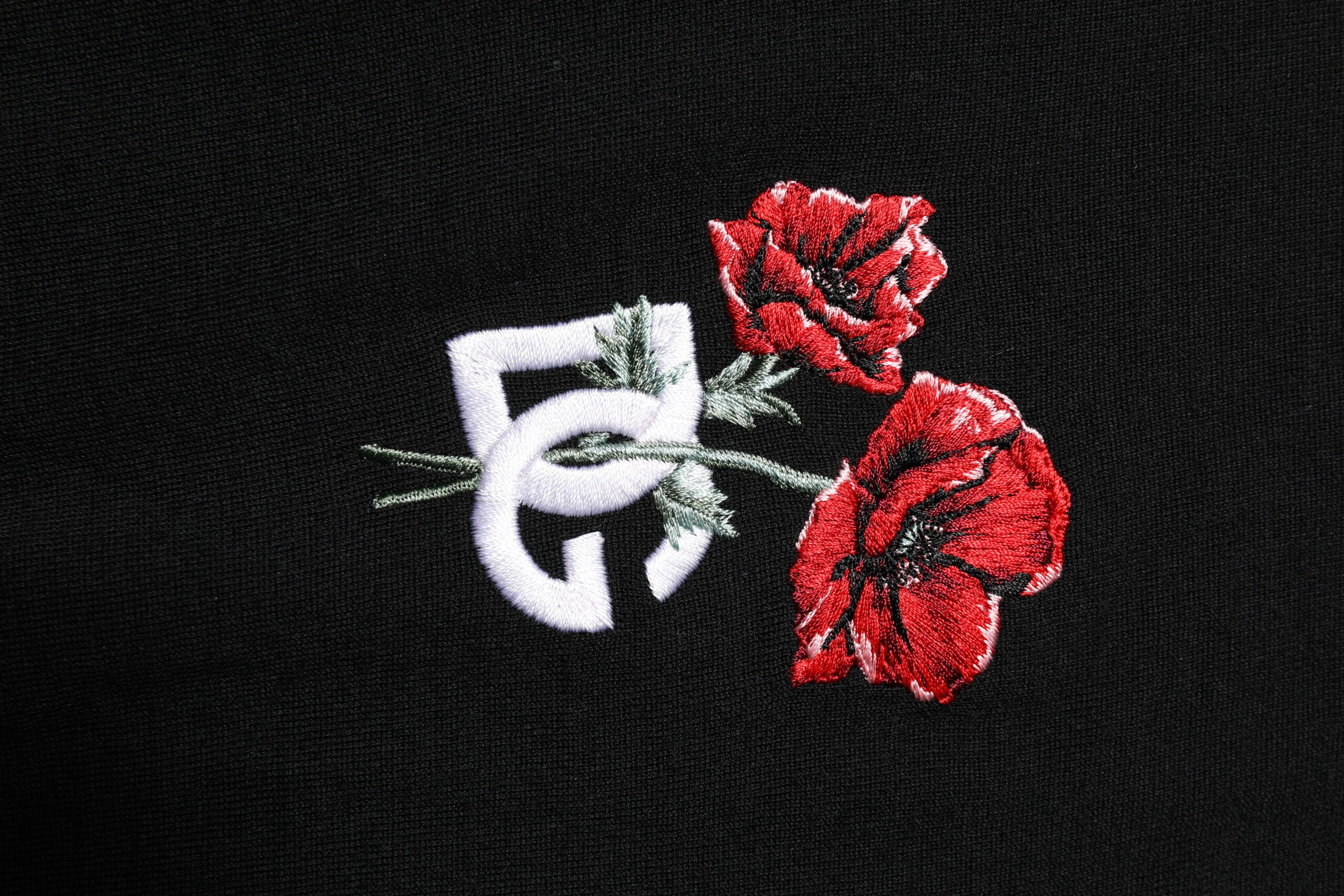 Dolce & Gabbana Schwarzes Wolle DG Logo Rose Polo T-Shirt mit Kragen