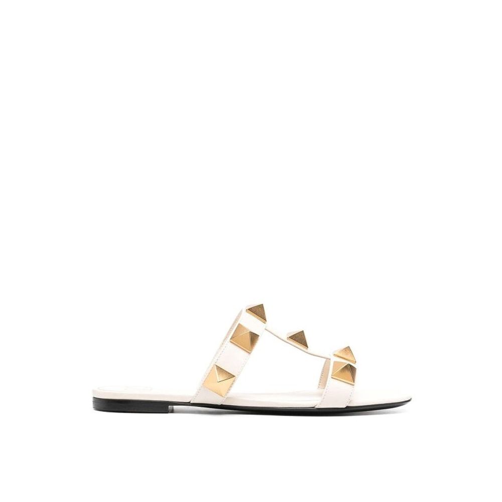 Valentino Garavani Flache Sandalen aus Leder mit römischen Nieten