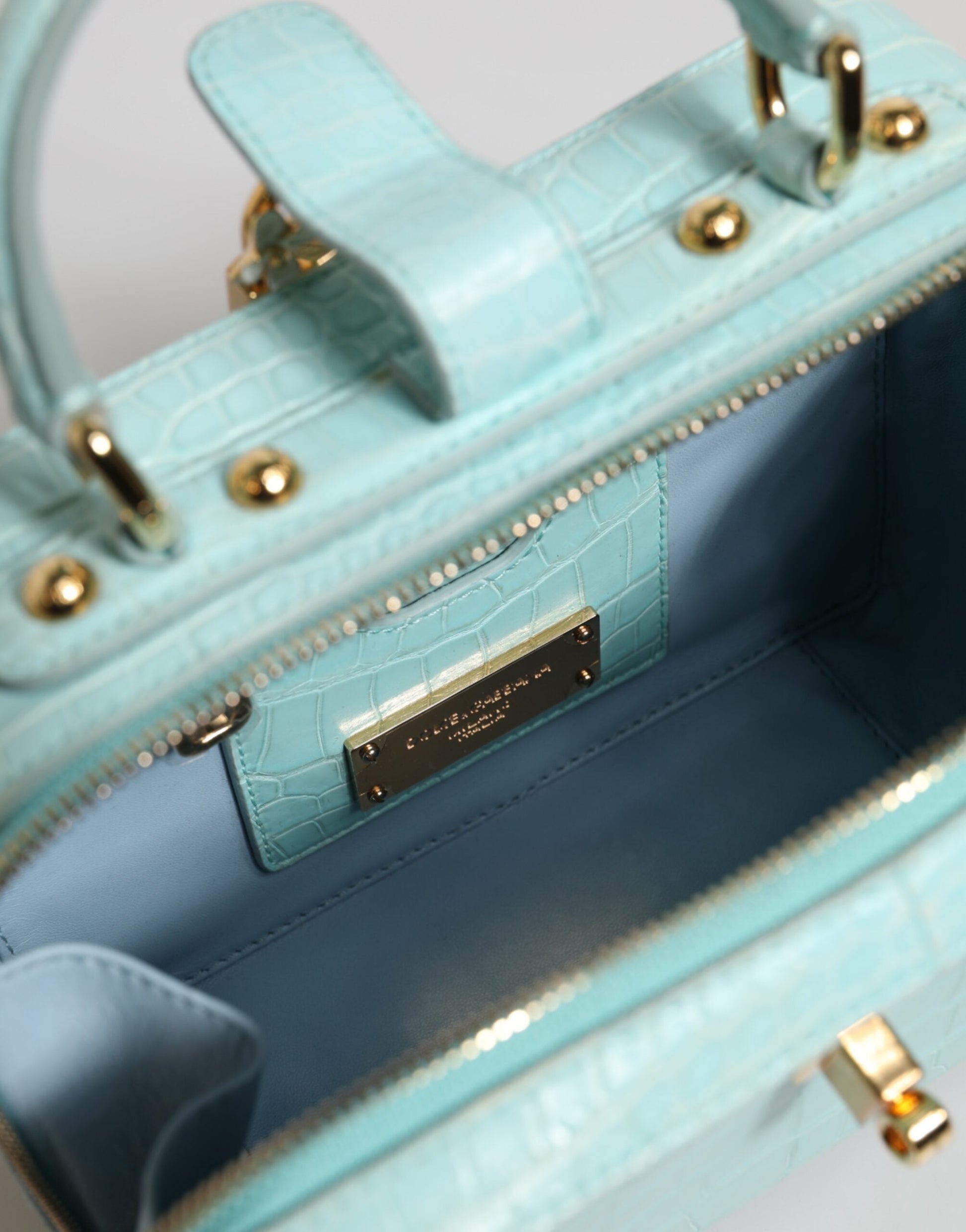 Dolce & Gabbana Mintgrüne Umhängetasche aus Leder mit geprägtem Vorhängeschloss