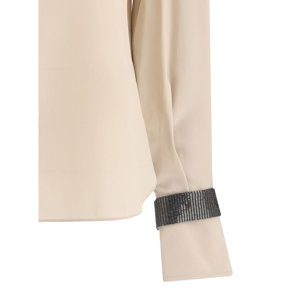 Brunello Cucinelli Seiden-Rollkragenbluse mit kostbaren Armbändern