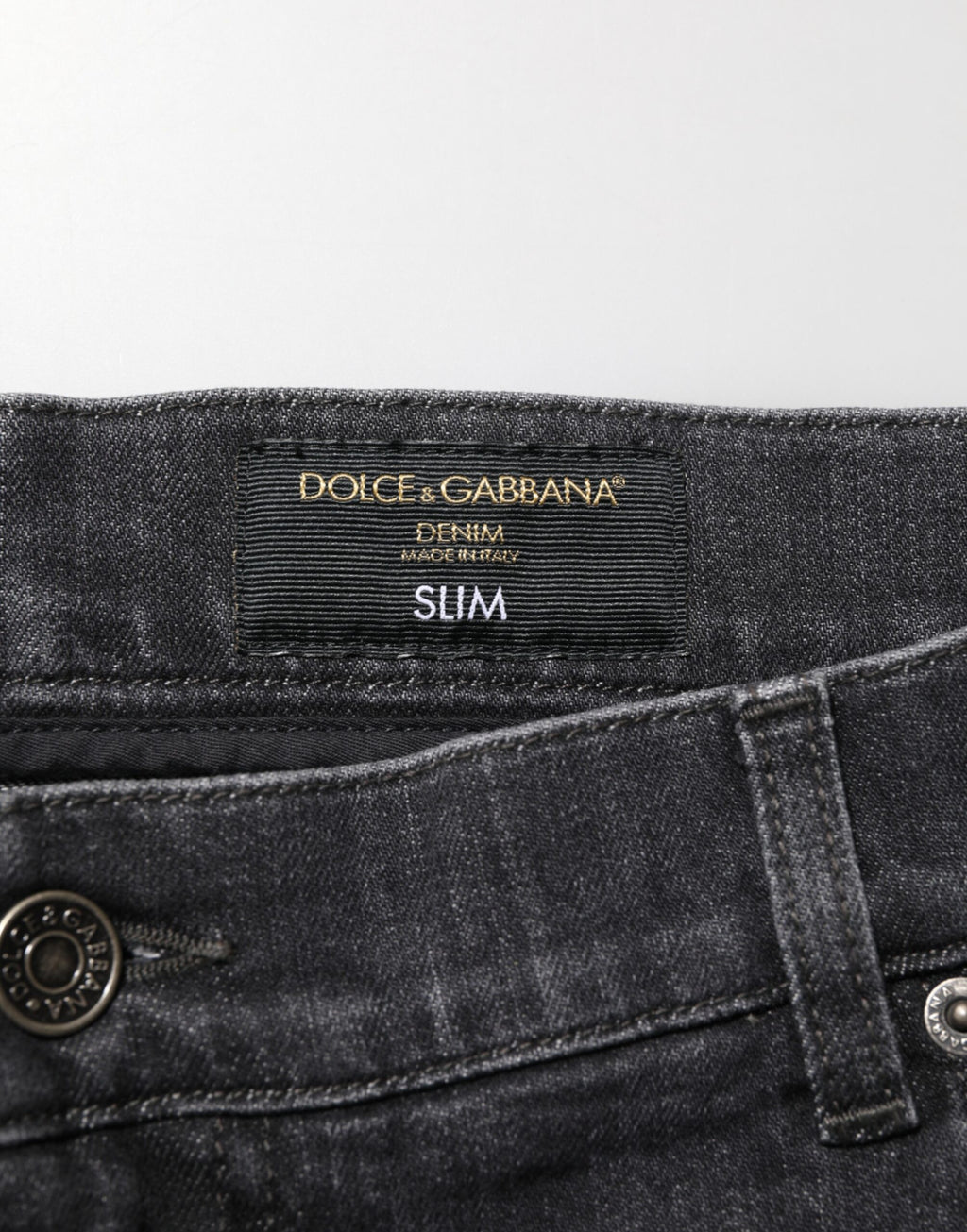 Dolce & Gabbana Schwarze Slim Fit-Jeans aus Baumwolle mit zerrissenem Logo