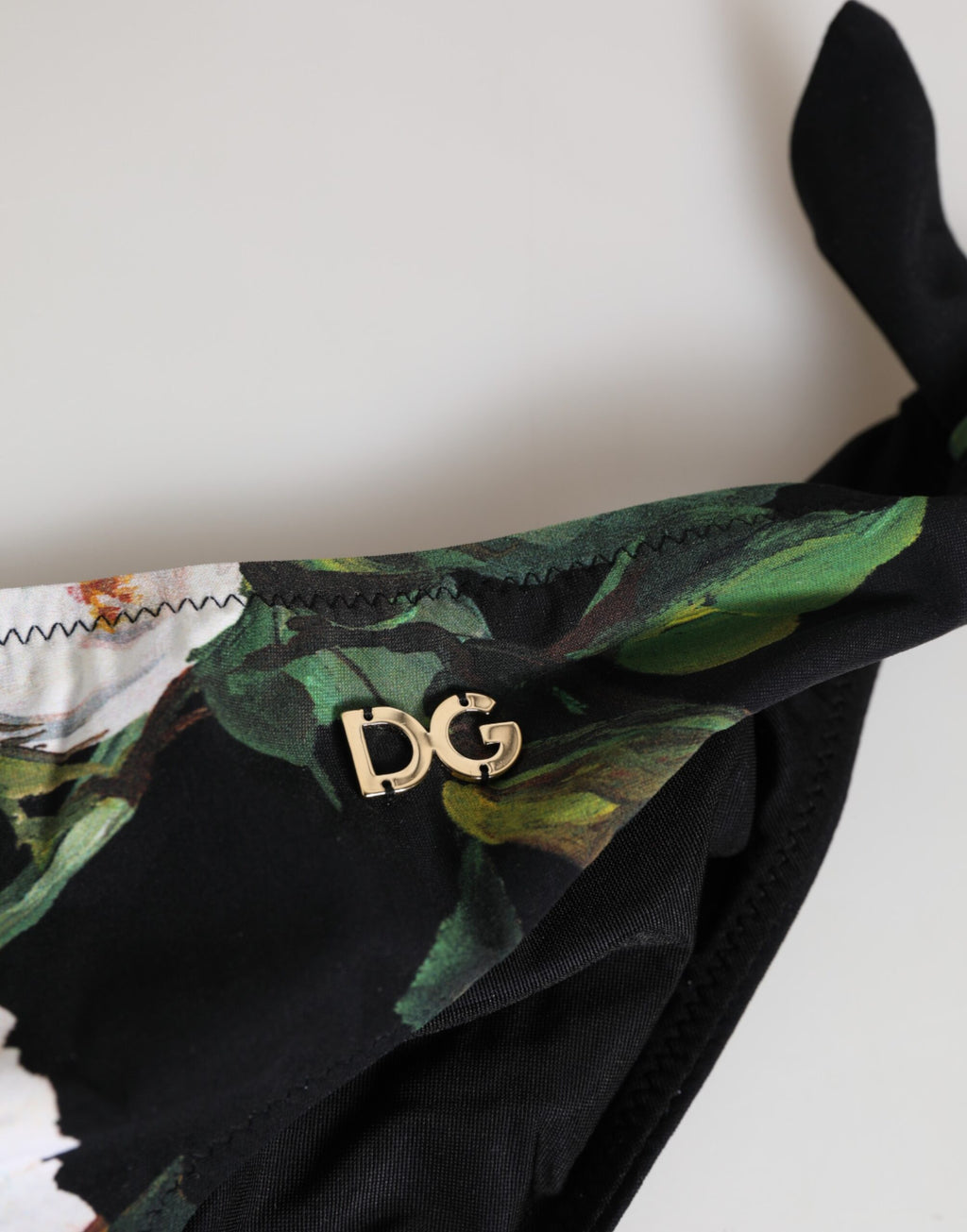 Dolce & Gabbana Schwarzes Bikini-Unterteil mit Blumenmuster und seitlicher Bindung Badebekleidung