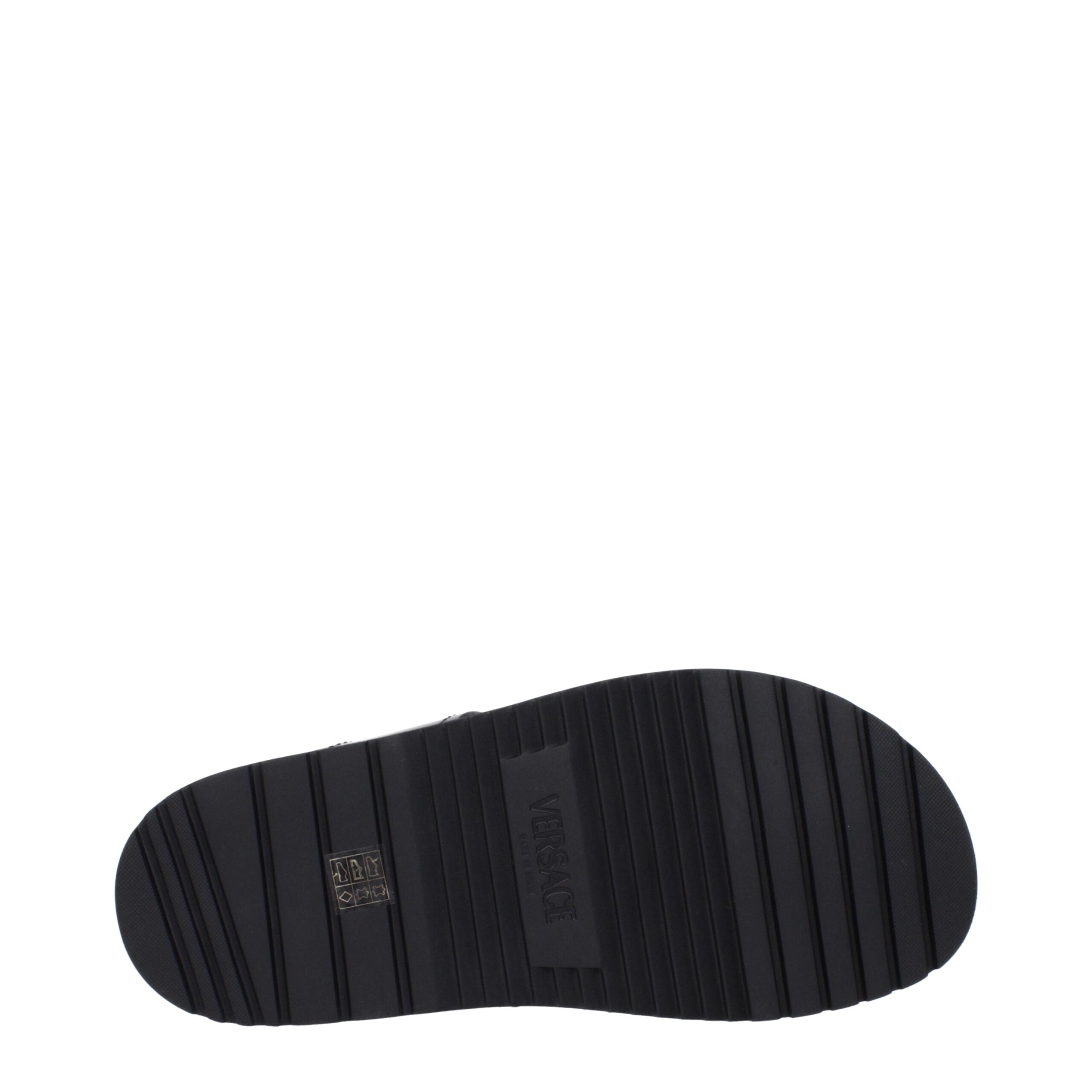 Versace Flache Sandalen aus schwarzem Leder