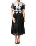 Dolce & Gabbana Schwarz-weißes Midi-Kleid aus Seiden-Makramee-Spitze