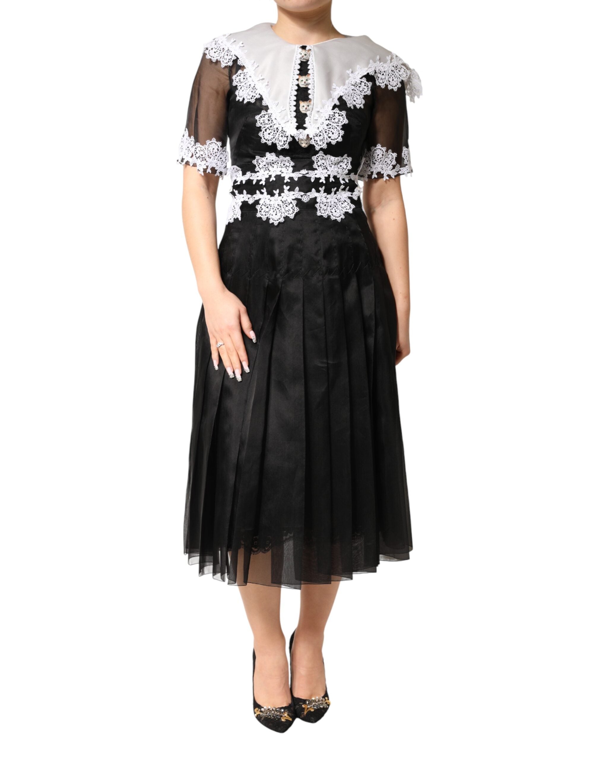 Dolce & Gabbana Schwarz-weißes Midi-Kleid aus Seiden-Makramee-Spitze