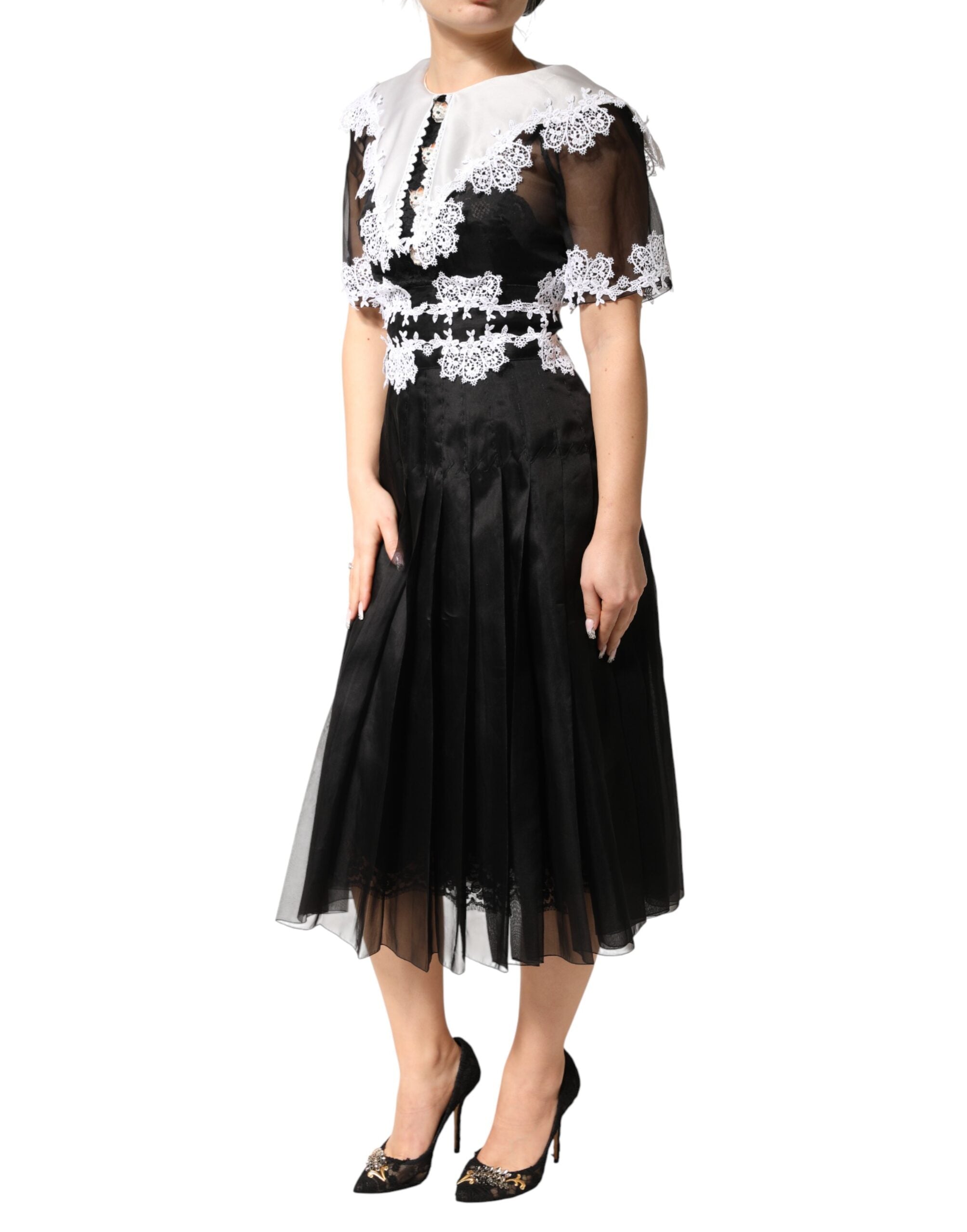 Dolce & Gabbana Schwarz-weißes Midi-Kleid aus Seiden-Makramee-Spitze