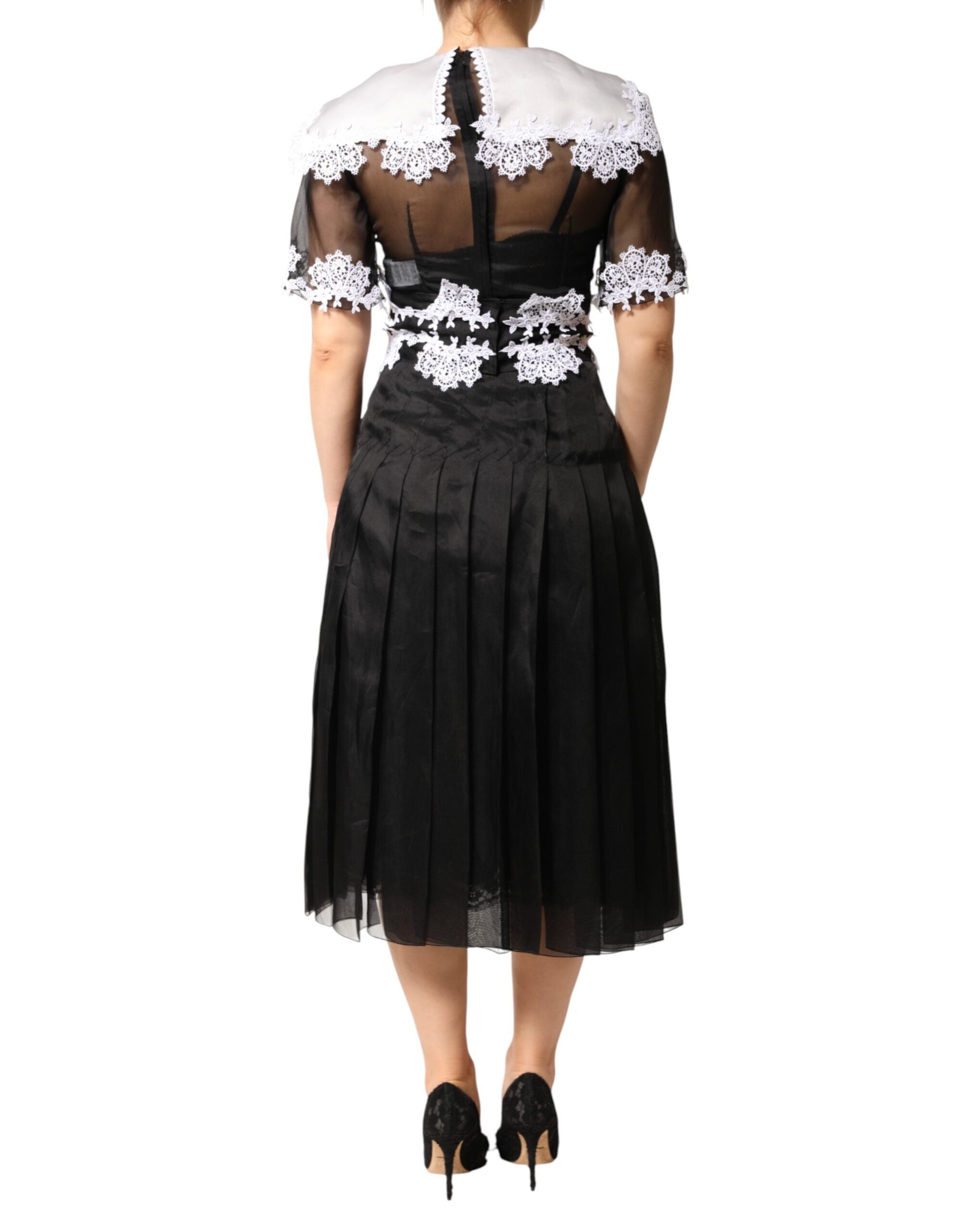 Dolce & Gabbana Schwarz-weißes Midi-Kleid aus Seiden-Makramee-Spitze